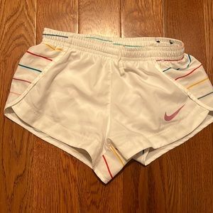 Nike white and multi color stripes on the back girls small shorts.